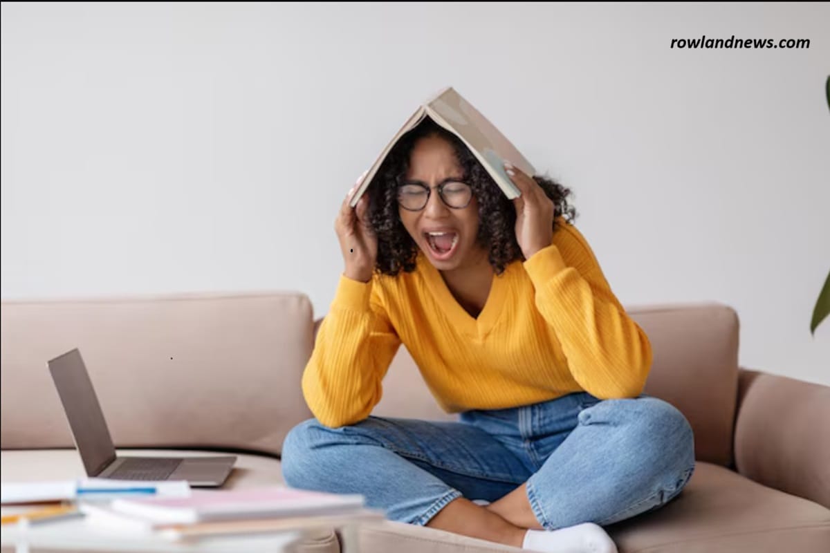 A lady screeming with a book on her head